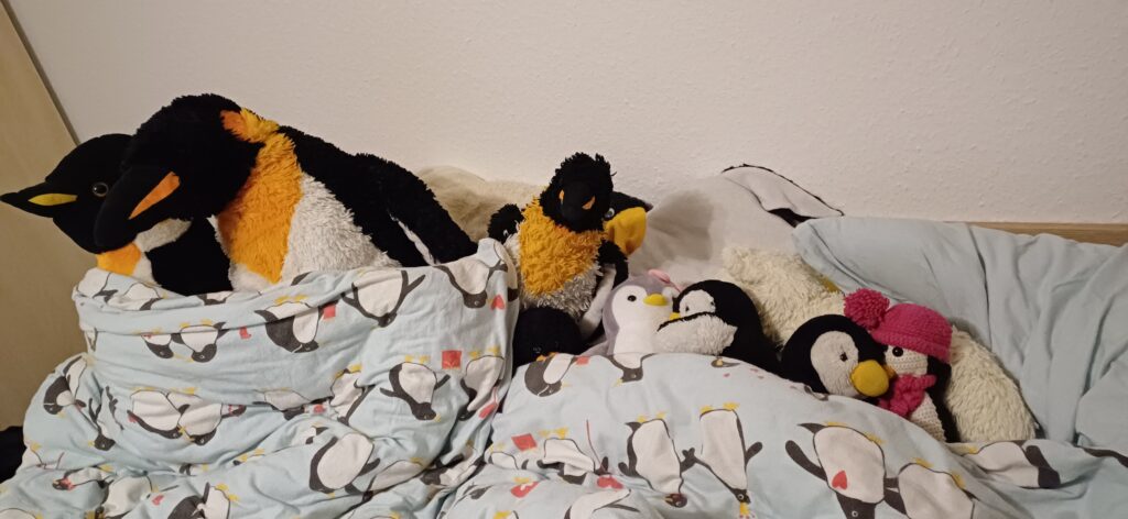 Pinguine im Bett